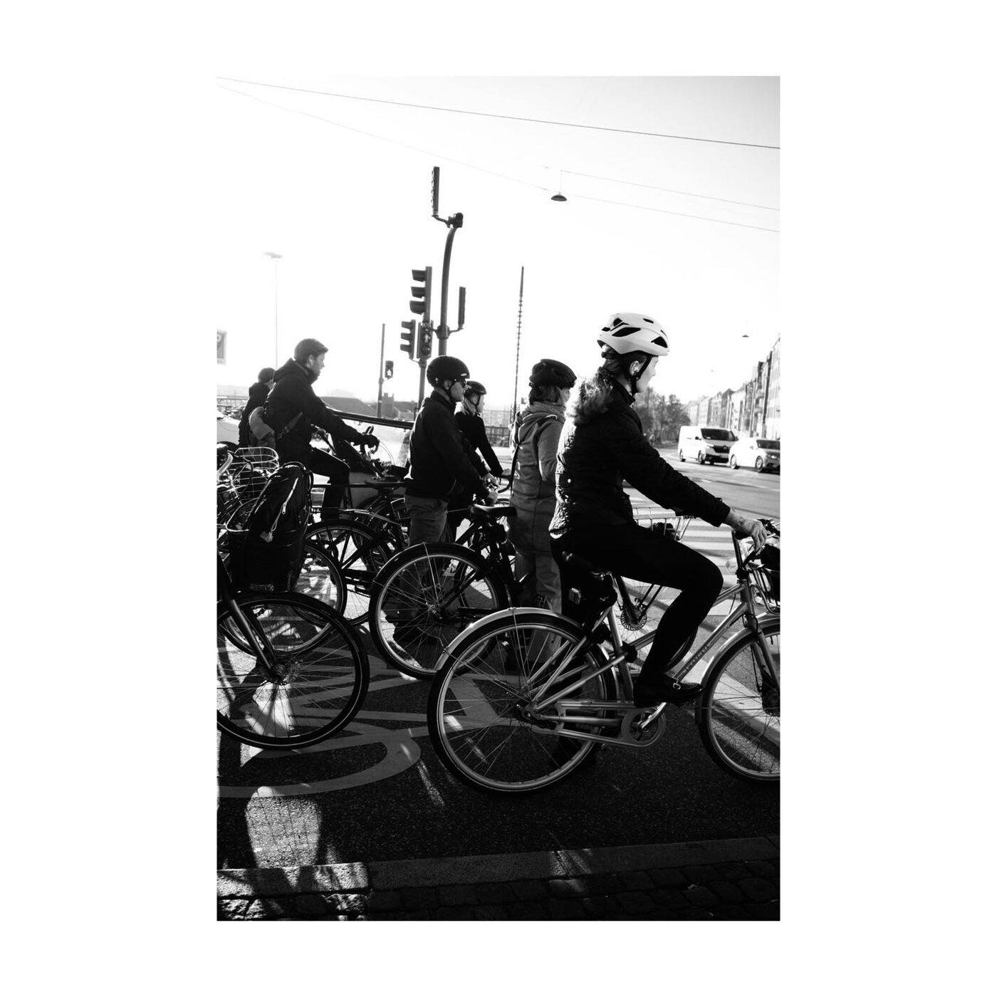 A group of cyclists in black and white